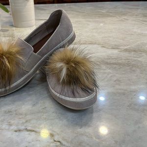 Sondra Robert’s casual slip on loafer with fur pompon.